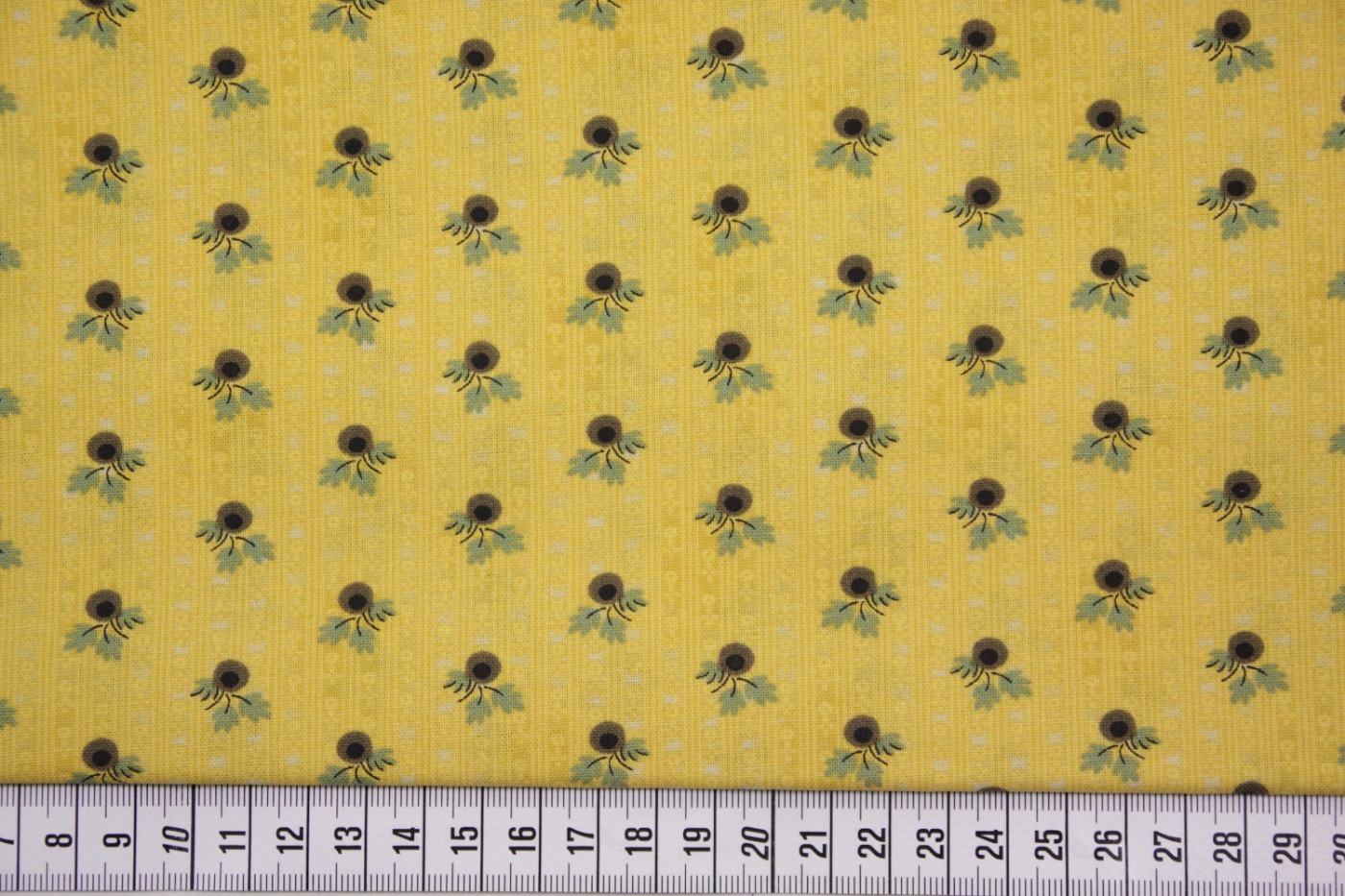 quiltstof-geel- goen takje met bruine be
