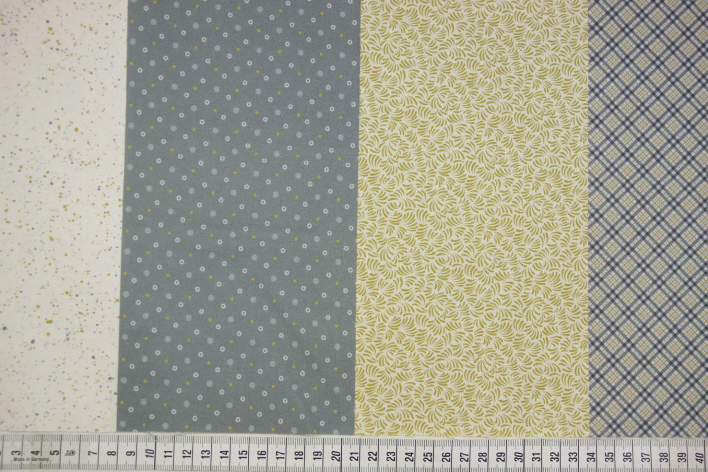 quiltstof-Geel, grijs en ivoor in 8 vert.