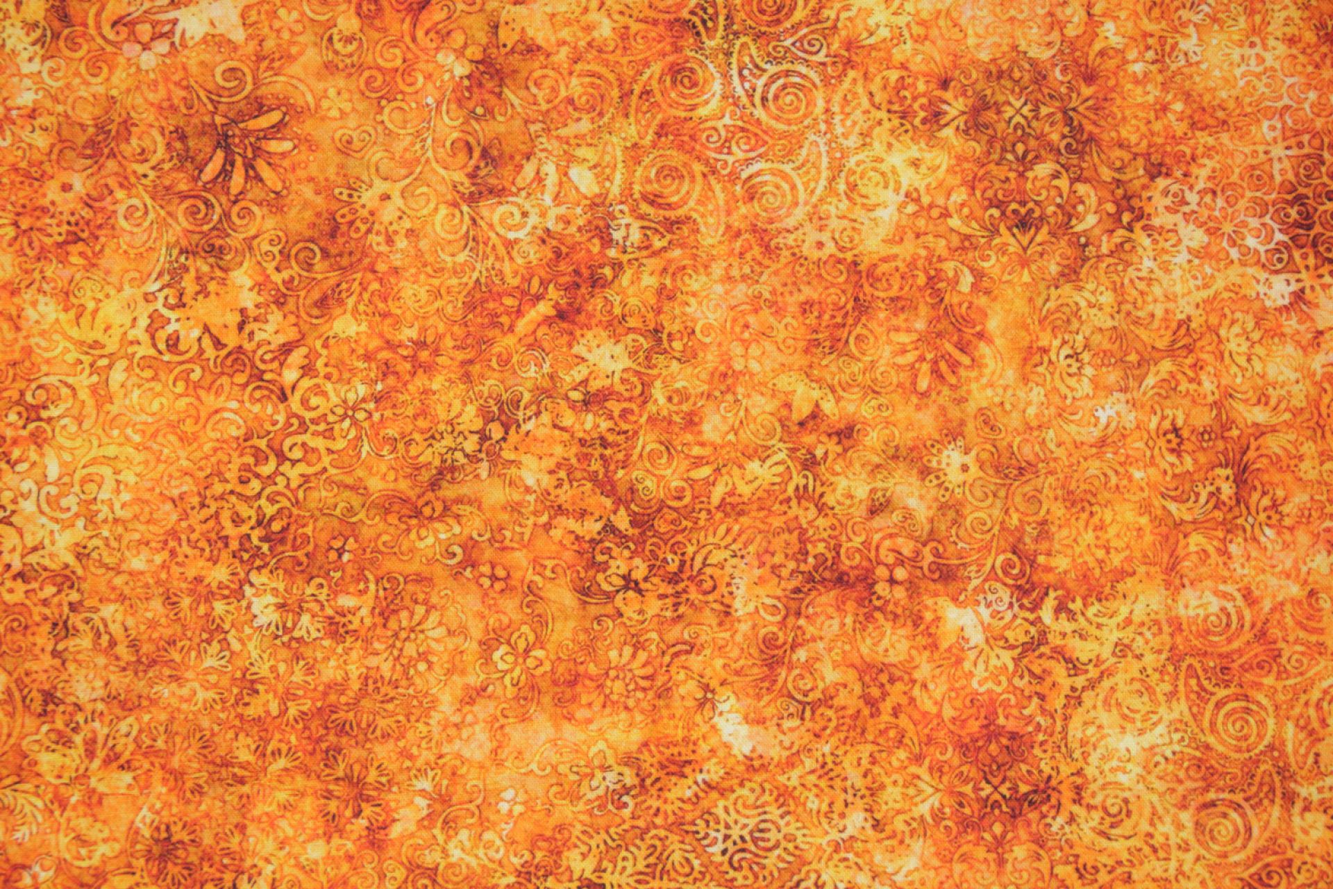 quiltstof-Oranje tinten met bloem-en bla