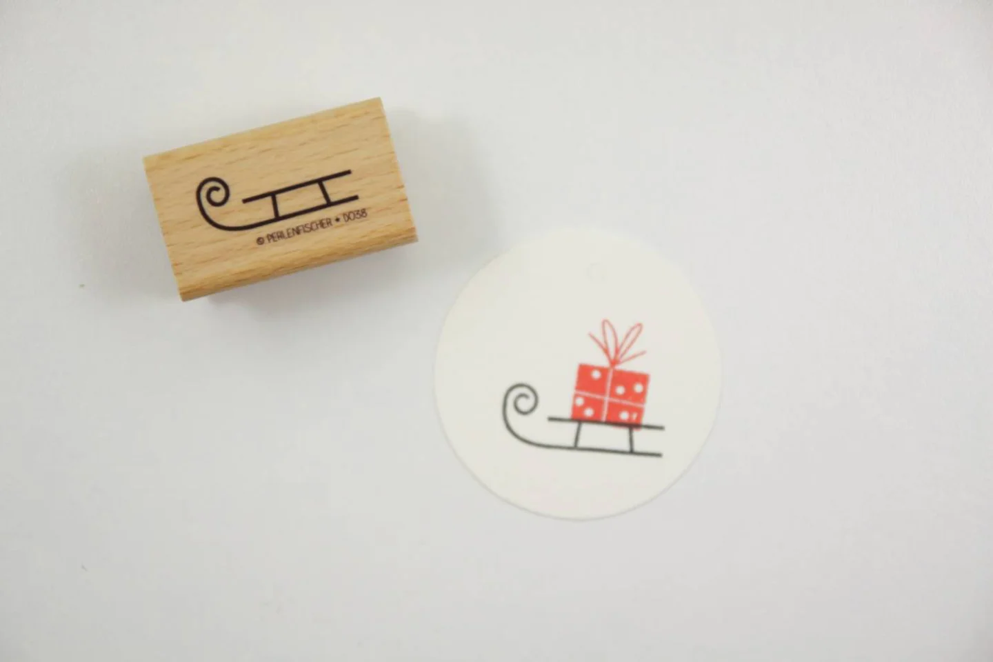 houten stempel slee perlenfischer 1.