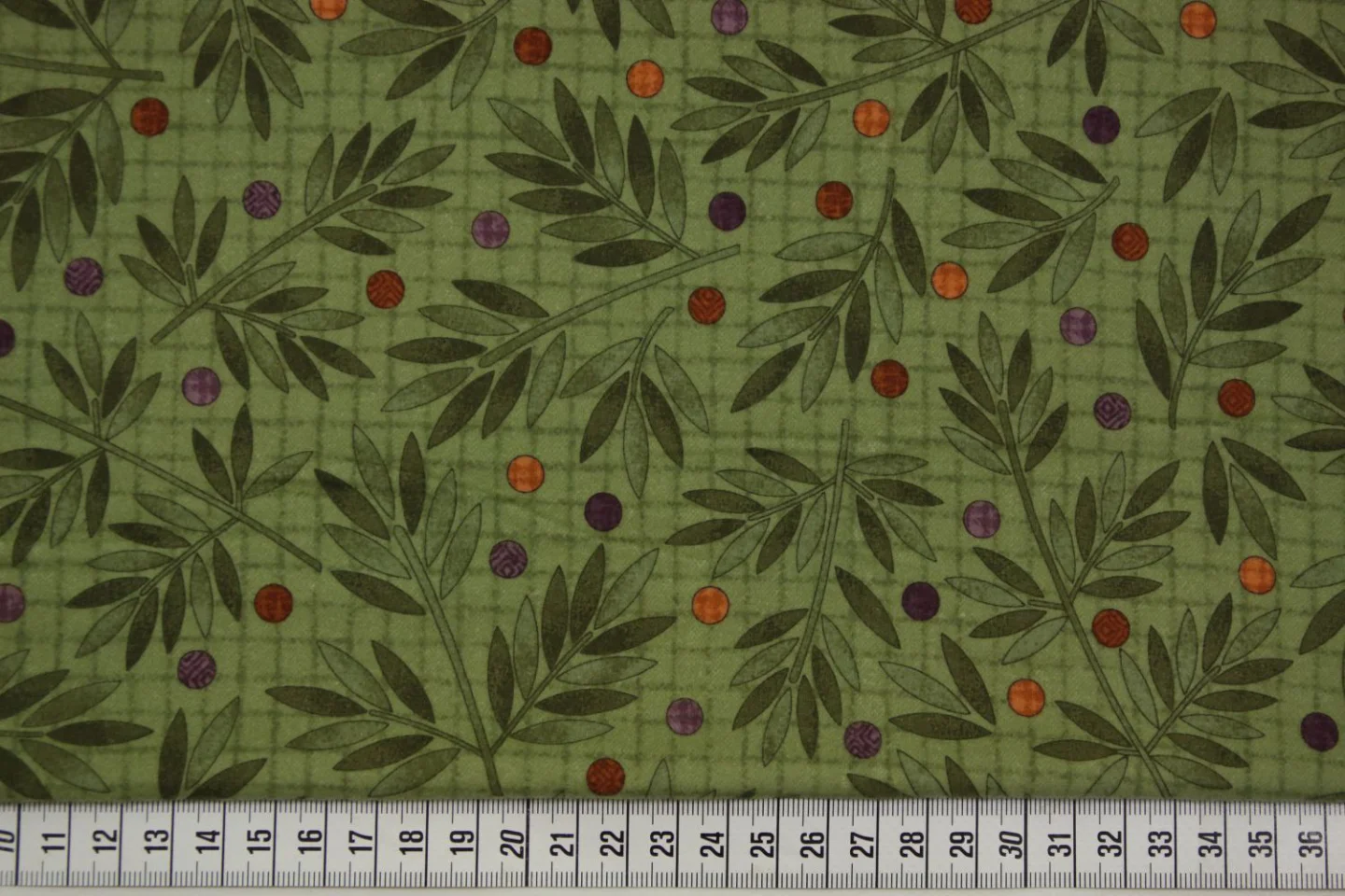 quiltstof-Groen met bladeren en gekleurd.