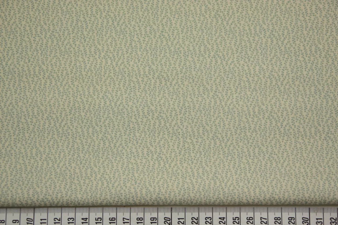 quiltstof-ecru-zeeblauwe slingertakjes-M.