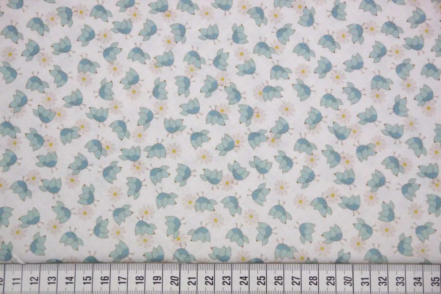 quiltstof-Ivoor met blauwe vogeltjes,The.