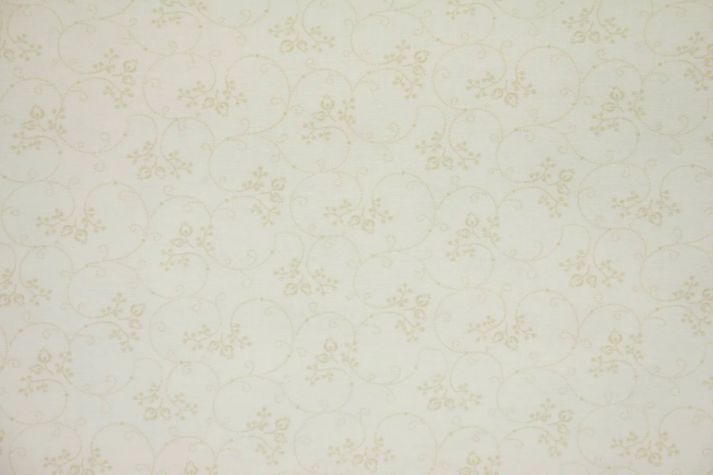 quiltstof-ivoor met,beige gestippelde ta.
