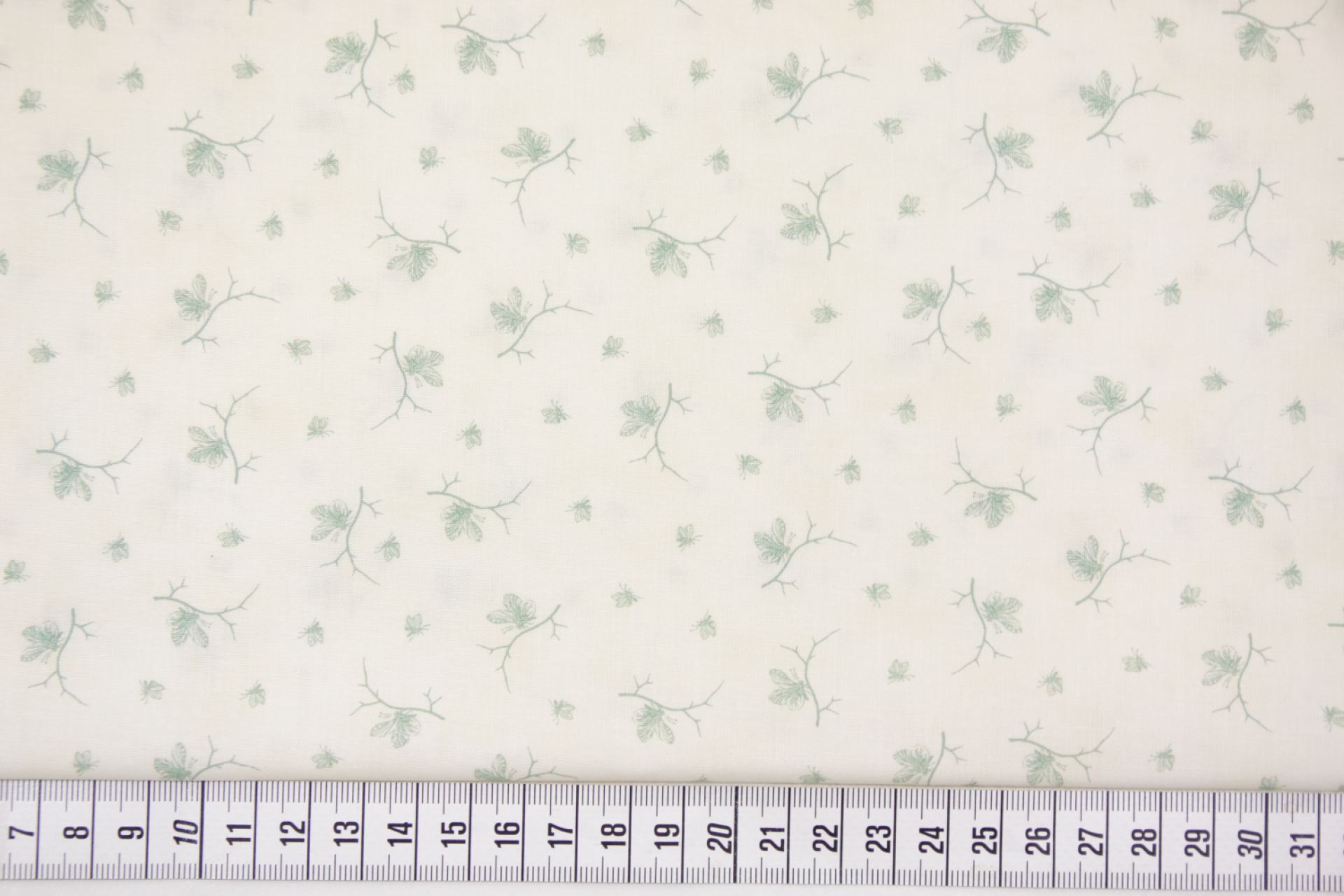 quiltstof-Roomwit met zeegroen vlindertj