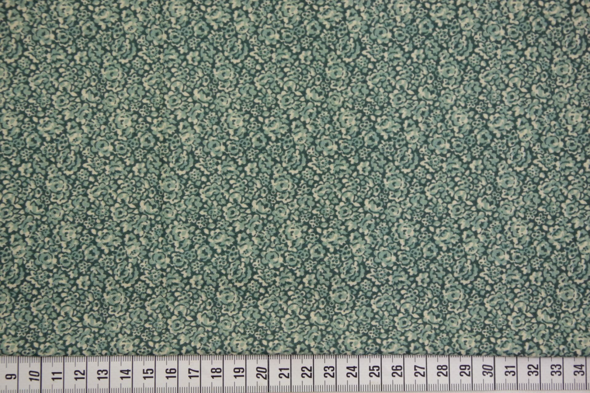 quiltstof-Flessengroen met zeegroene blo