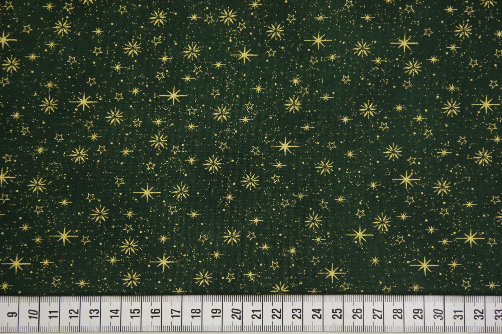 quiltstof-kerst-Donkergroen met gouden s