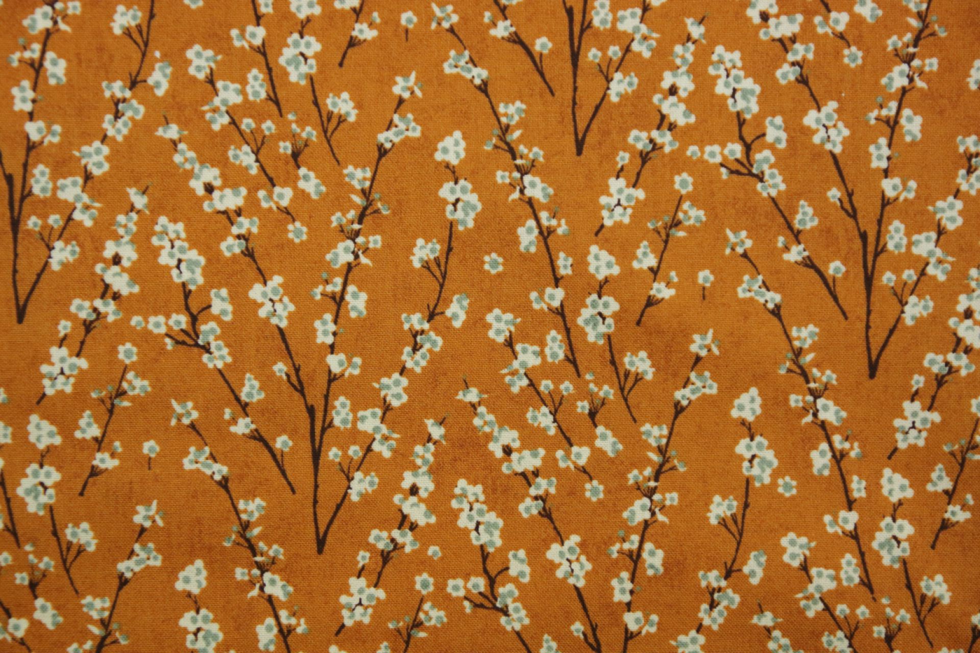 quiltstof-Warm oranje met bloeiende takk