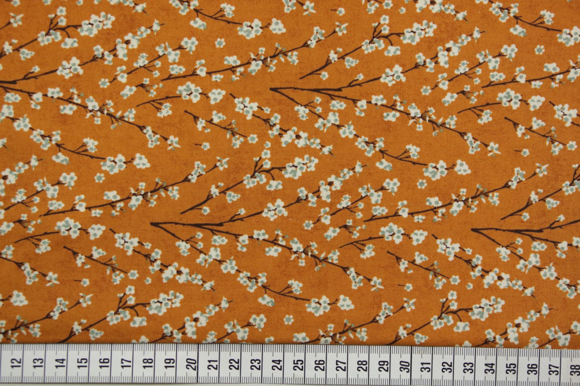quiltstof-Warm oranje met bloeiende takk
