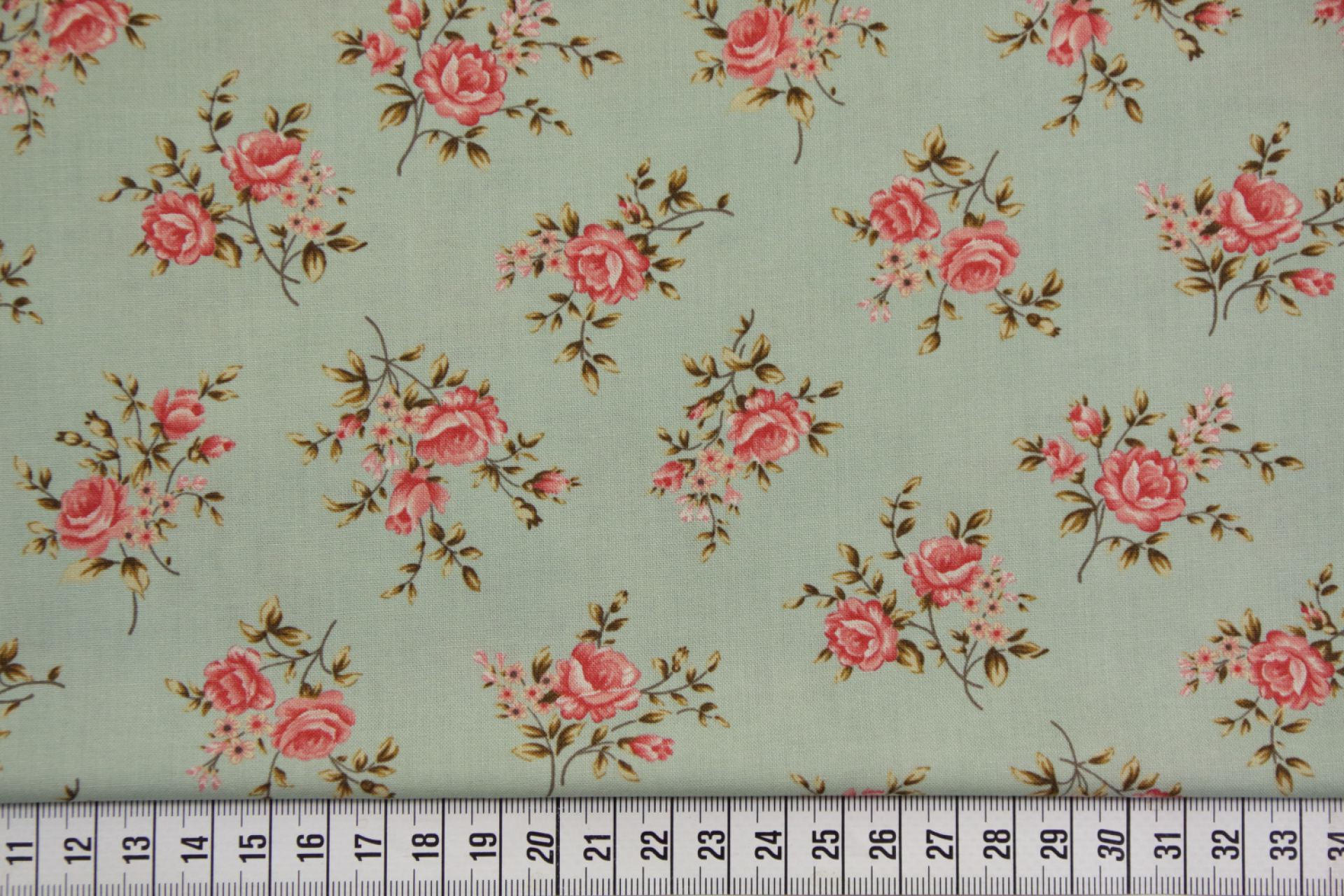 quiltstof-Licht turquoise met rozenboeke