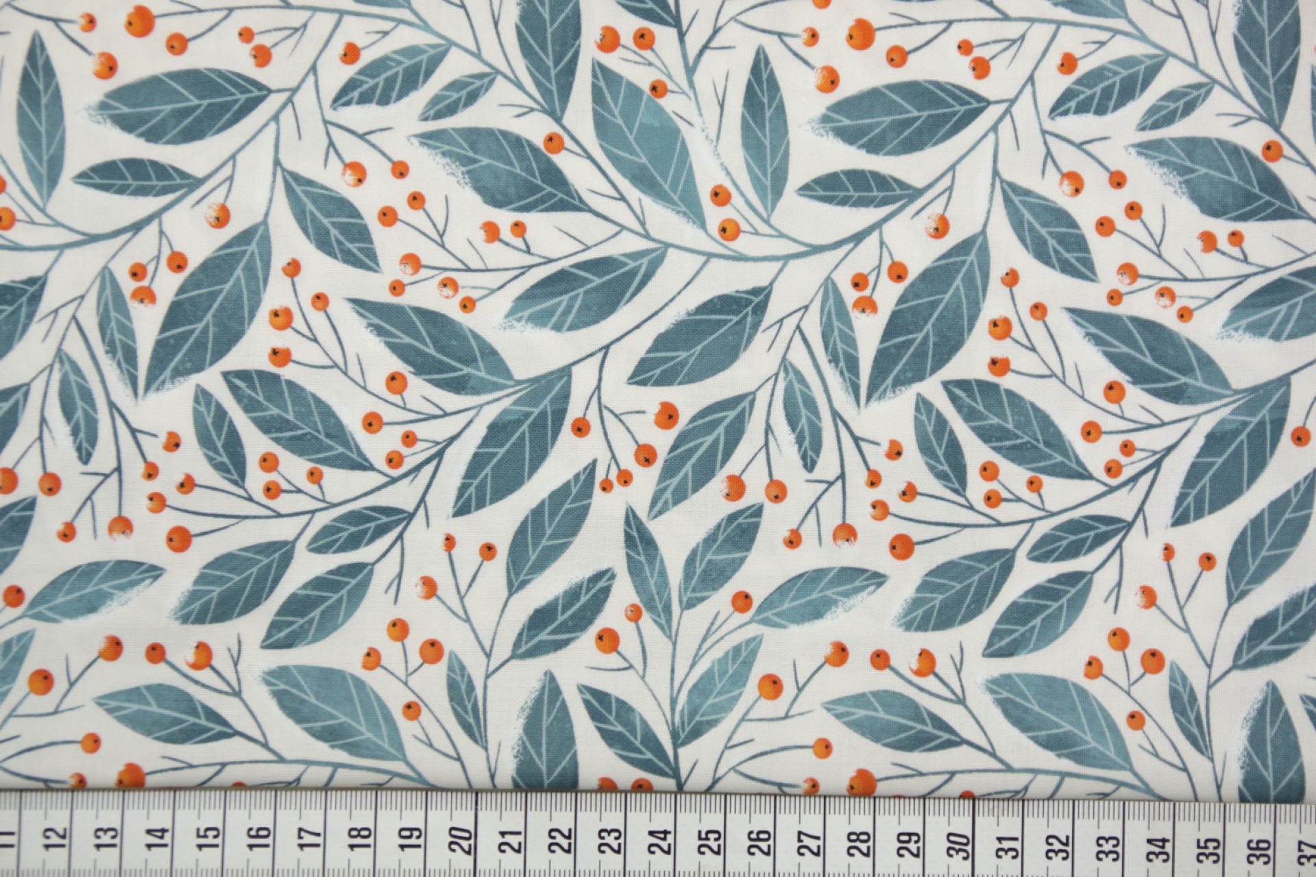 quiltstof-Ivoor petrol blaadjes en oranj