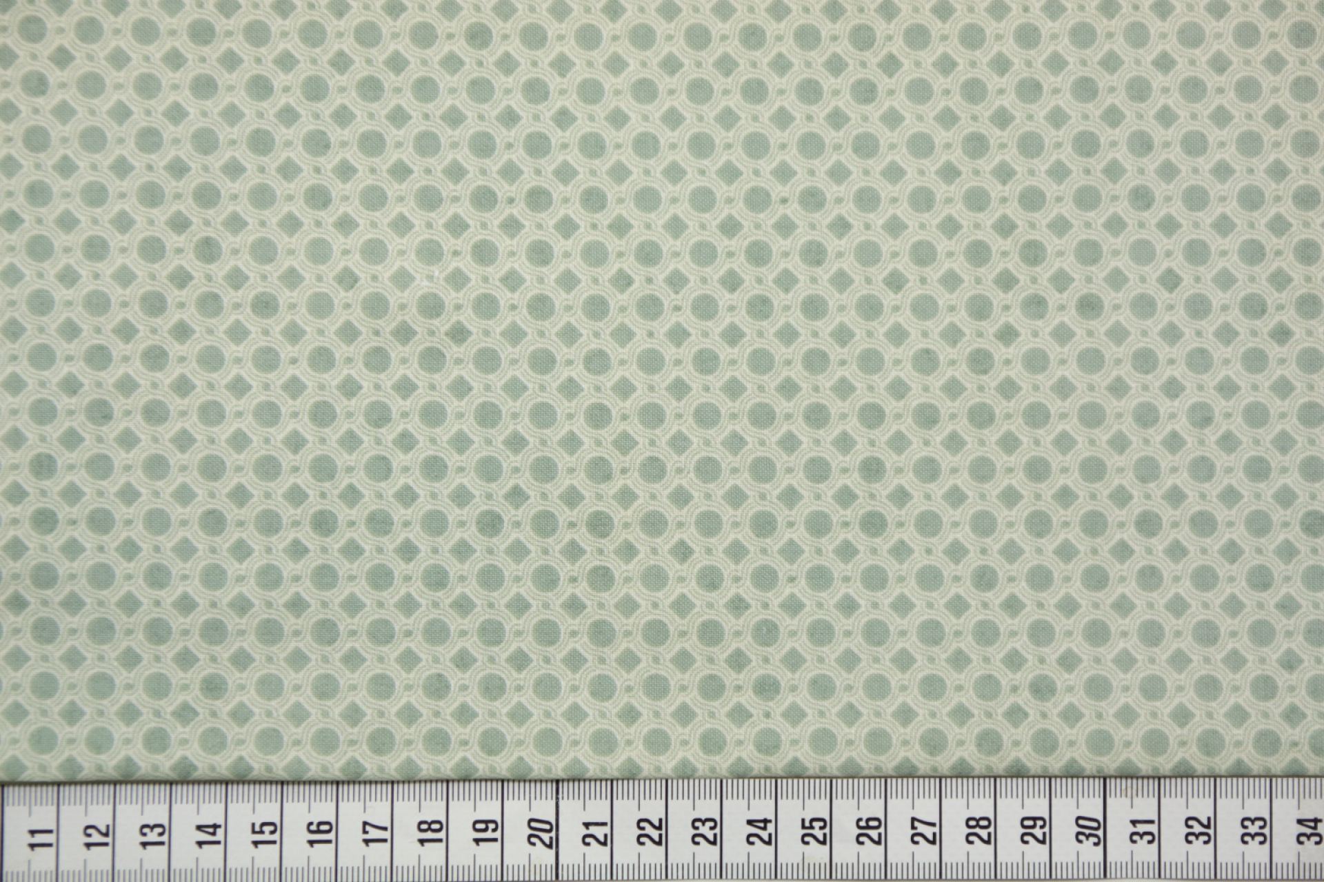 quiltstof-Ivoor met zeegroen stip-en r2i