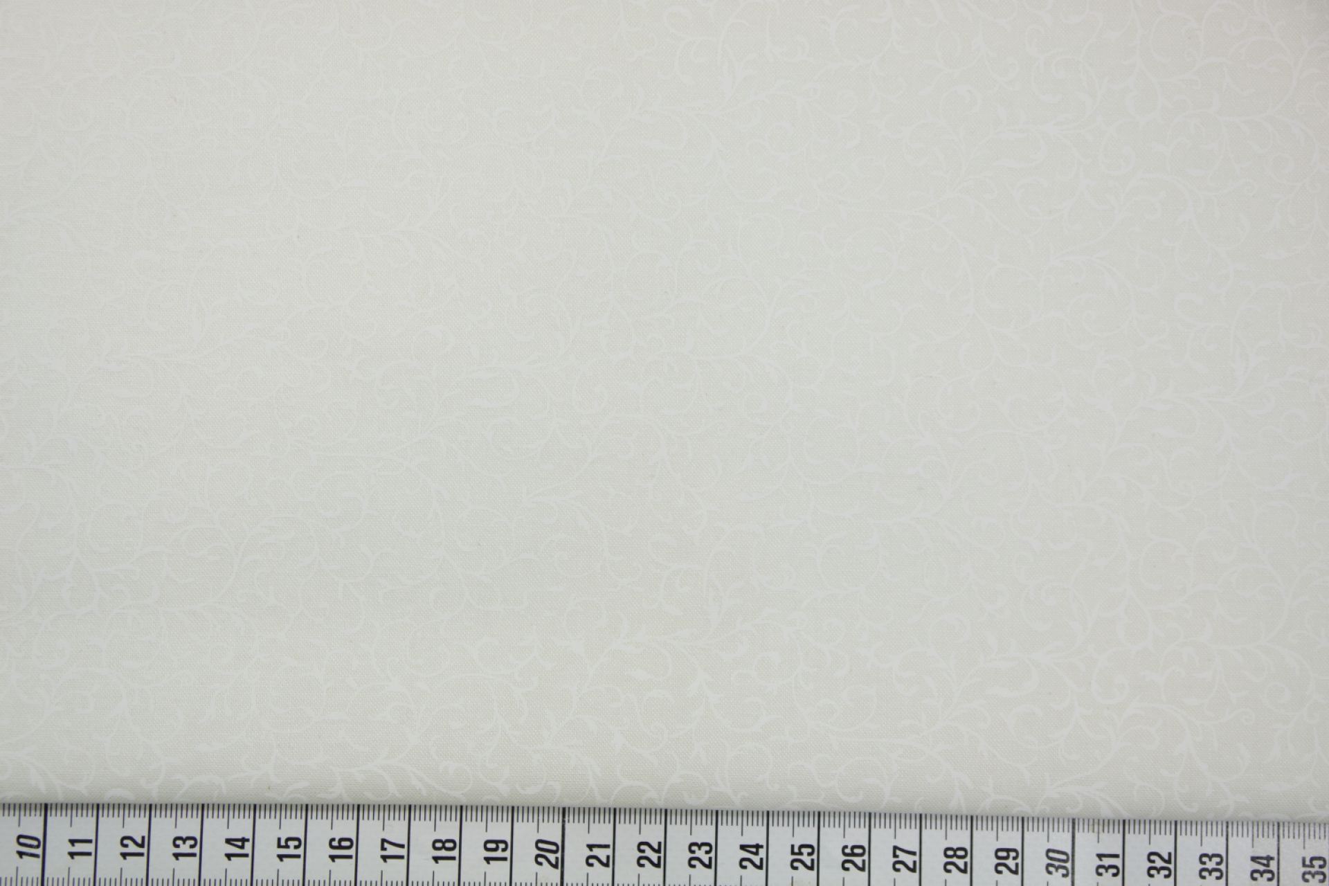 quiltstof-Ivoor met slingerende takken-