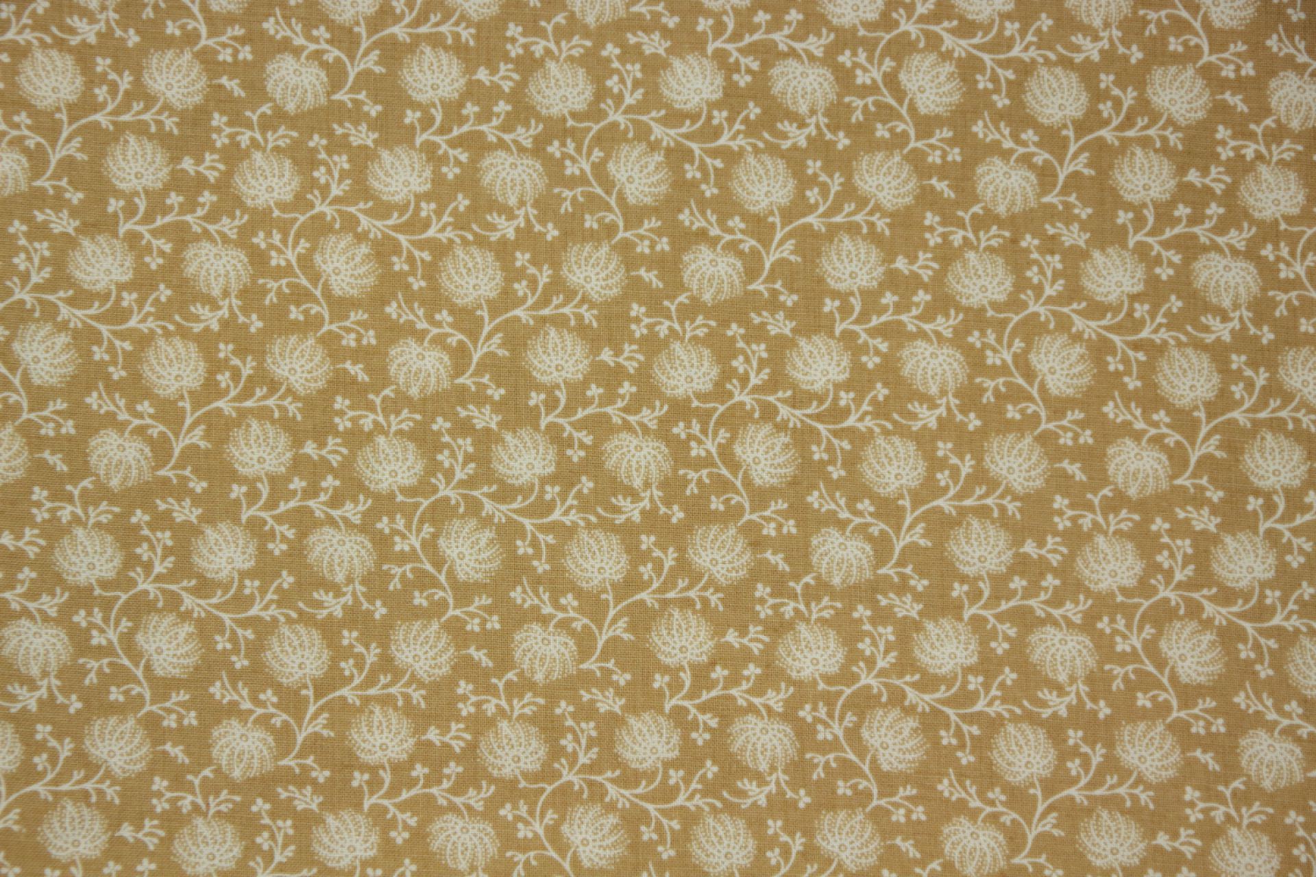 quiltstof-Okerbruin met bloemtakjes in i