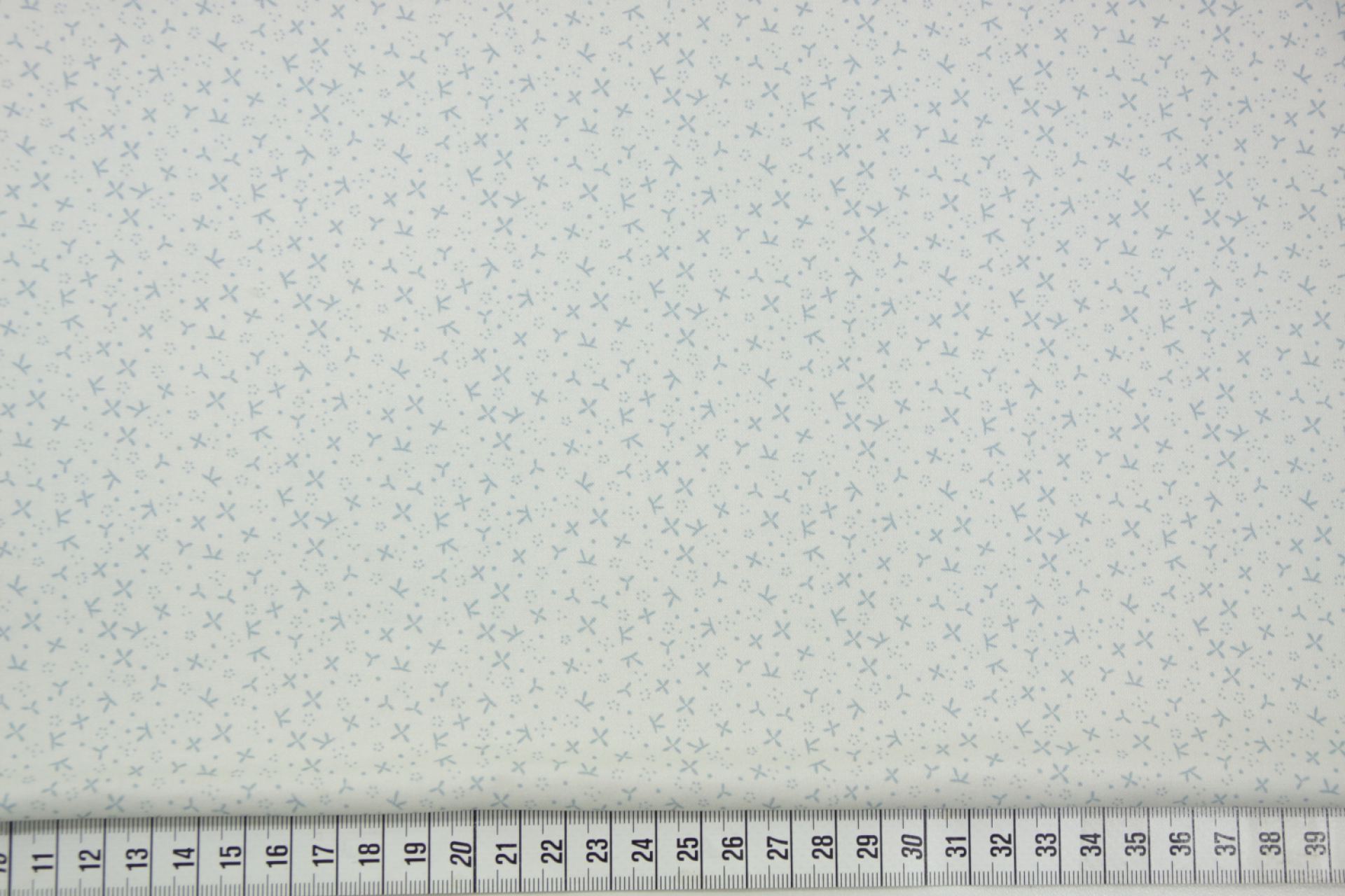 quiltstof-Ivoor met oudblauwe motiefjes-